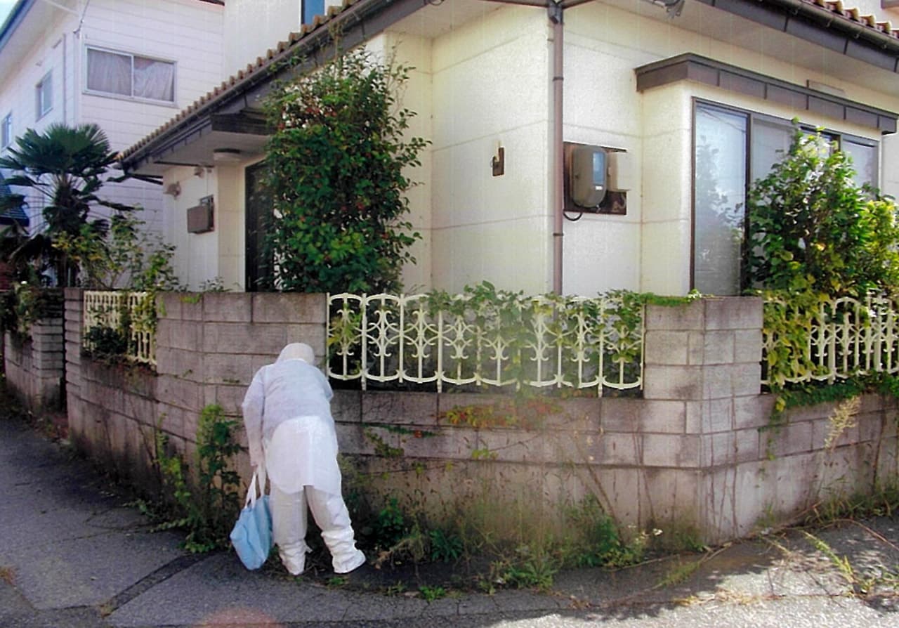 <防護服を着て一時帰宅>